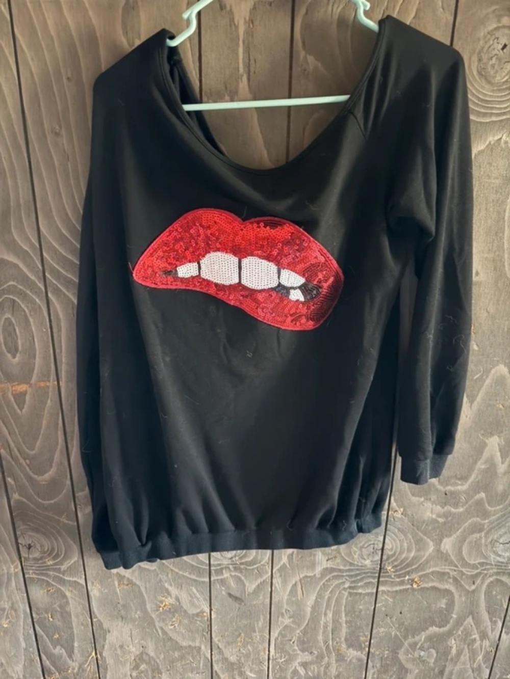Black off the shoulder lip shirt